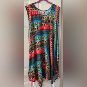 Studio Woman Dress with geometric pattern and asymmetrical hemline.